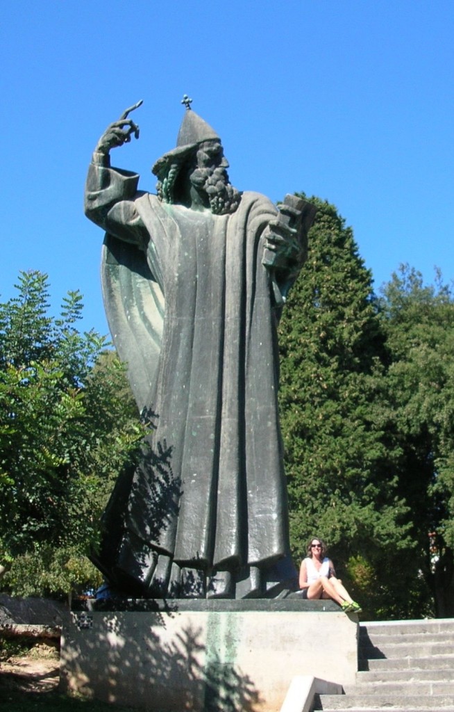 A colossal statute of Bishop Grgur Ninski by sculptor Ivan Meštrović dwarfs TCO Publisher, Marla Norman.