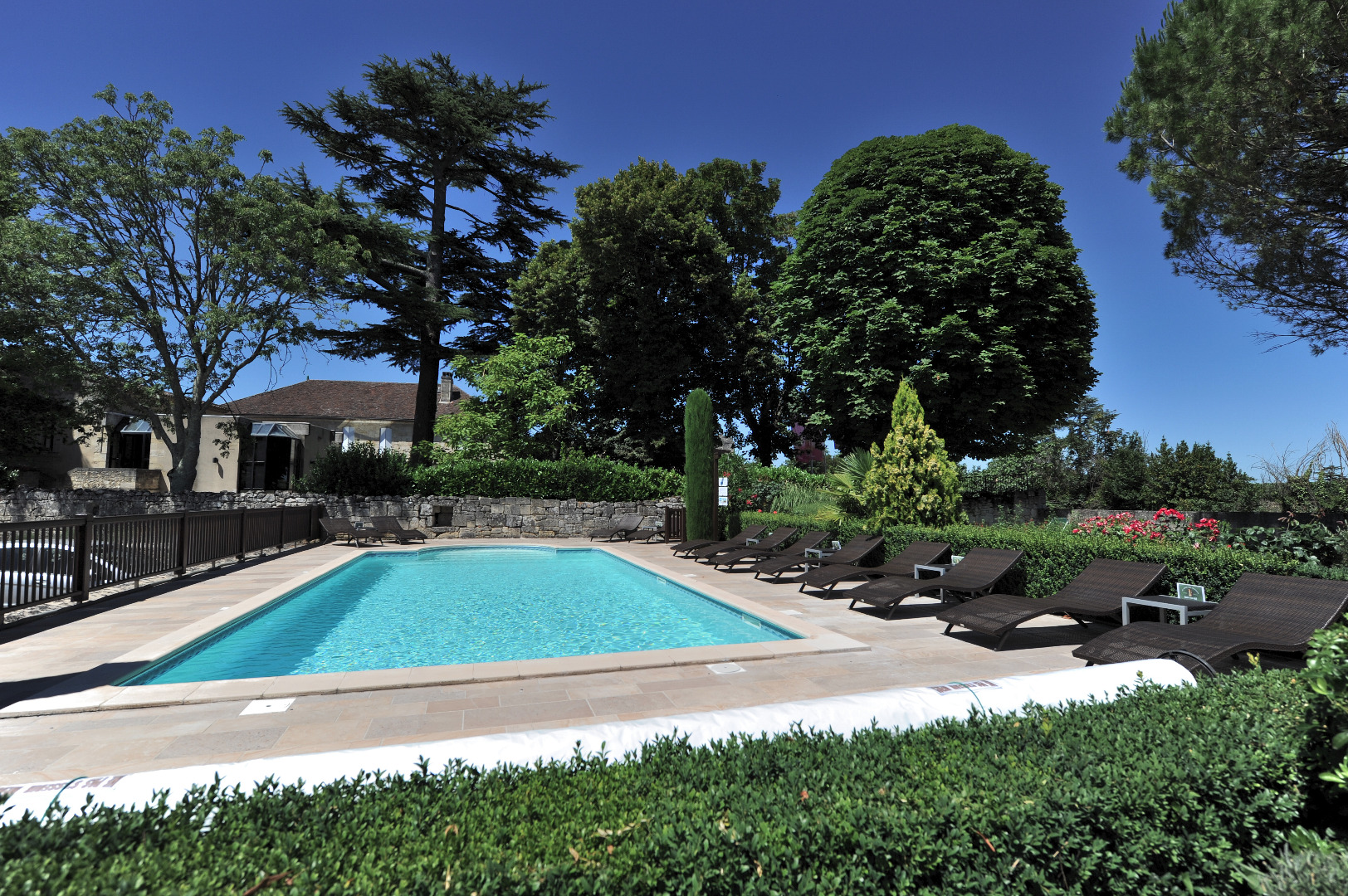 Gardens and inviting pool at Au Logis des Remparts. Photos courtesy of Au Logis des Remparts.