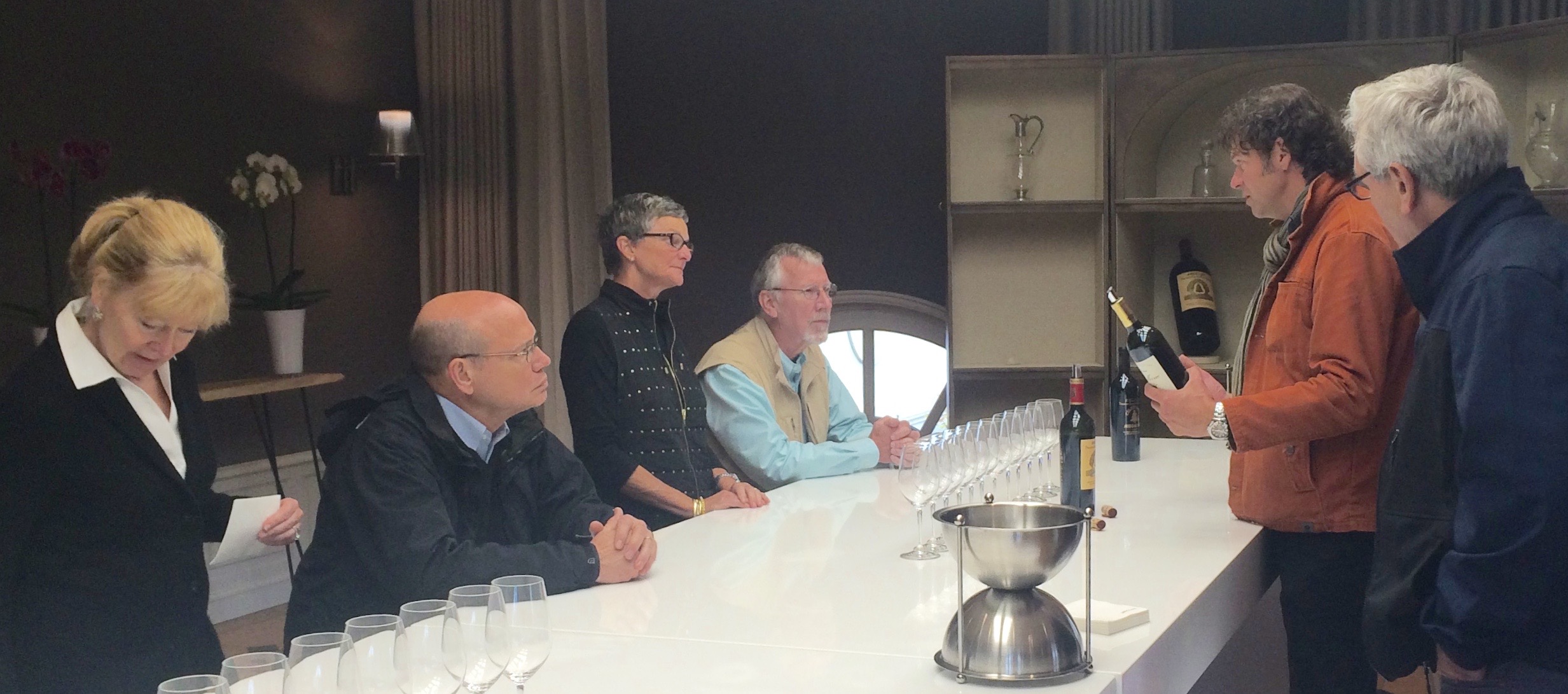 Drs. Bobbi & Dwight Oldham along with Dr. Melvin & Deborah Oakley listen attentively as Laurent Benoit and Michel Thibault discuss Angélus wines on a visit made possible by the Destin Charity Wine Auction Foundation.