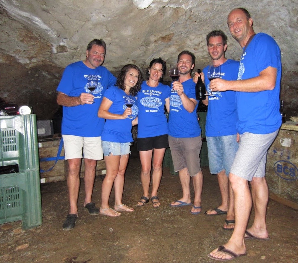 Team Blue Danube Wine Co. and team Štoka drinking sparkling Teran in their natural Karstic cave: Primos Štoka, Kristyn Robbins, Marizia Štoka, Stetson Robbins, Tadej Štoka, Peter Štoka. Photo courtesy of Blue Danube Wine Co.