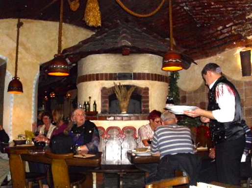 Waiters in traditional costumes at Gostilna Sokol.