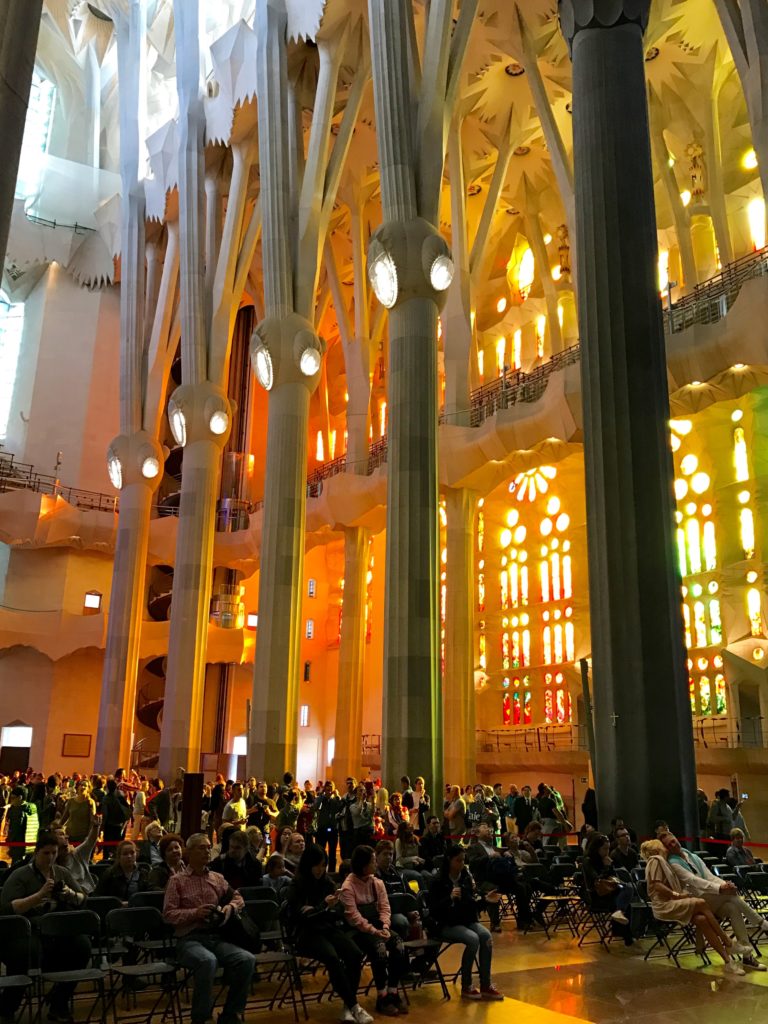 The cathedral interior is a dizzying 150 feet high. The west wall is ablaze with brilliantly coloredstained glass windows.