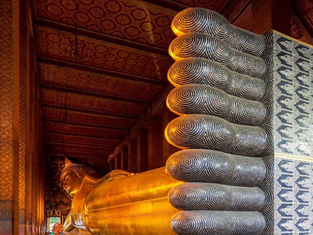 The "Reclining Buddha" is 150 feet long, covered in gold with ten-foot high feet. Photo from Wikipedia.