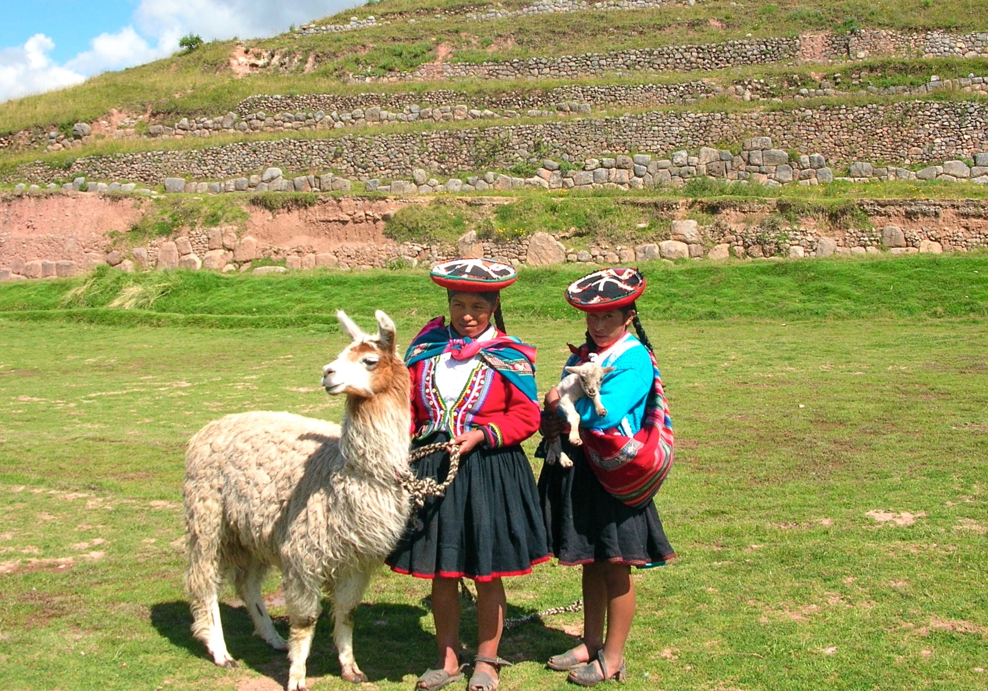 Inca women tend to their llama. Photo by Marla Norman.