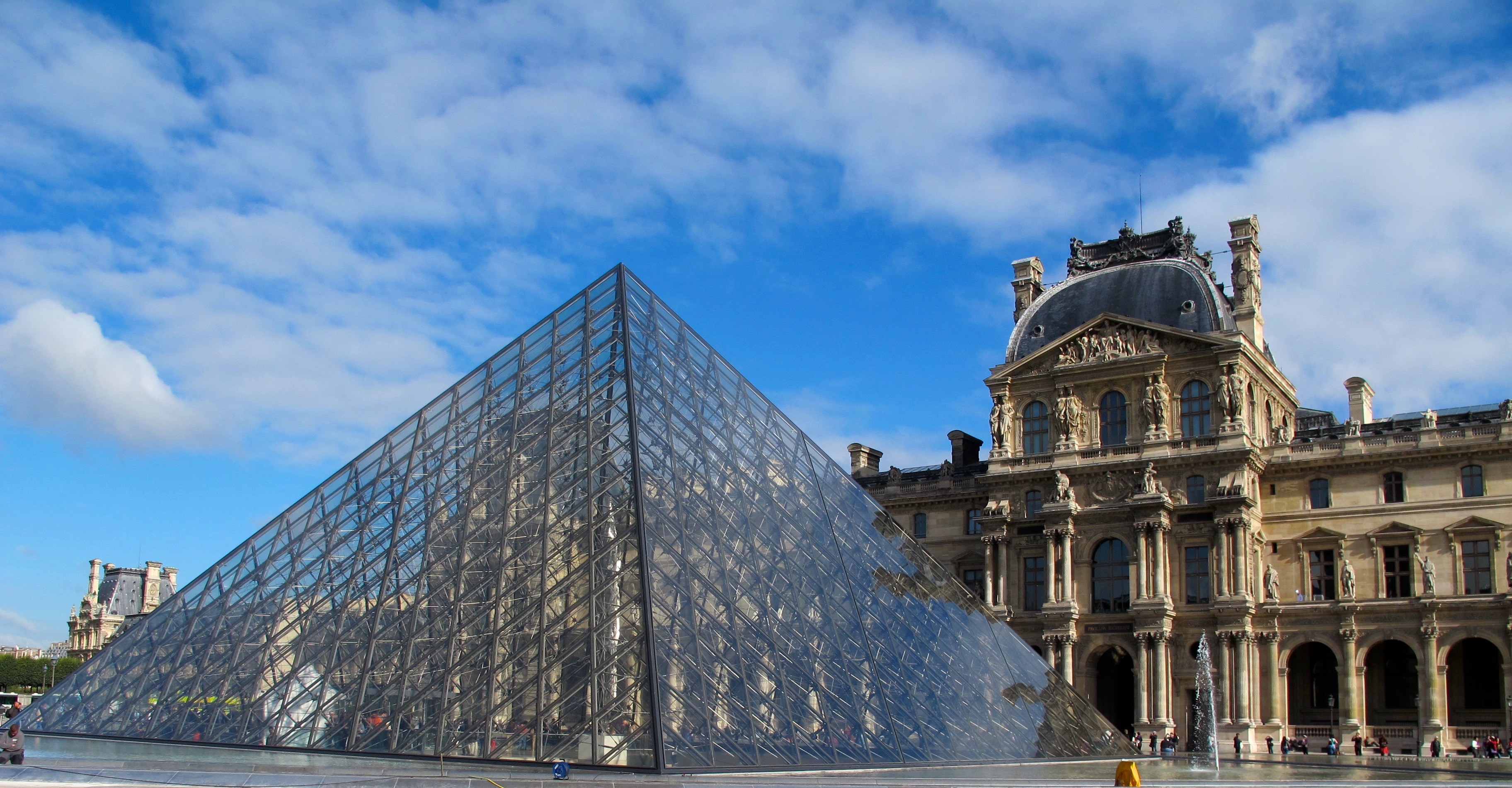 I.M. Pei glass pyramid and Louvre"You can’t escape the past in Paris, and yet what’s so wonderful about it is that the past and present intermingle so intangibly that it doesn’t seem to burden." Allen Ginsberg