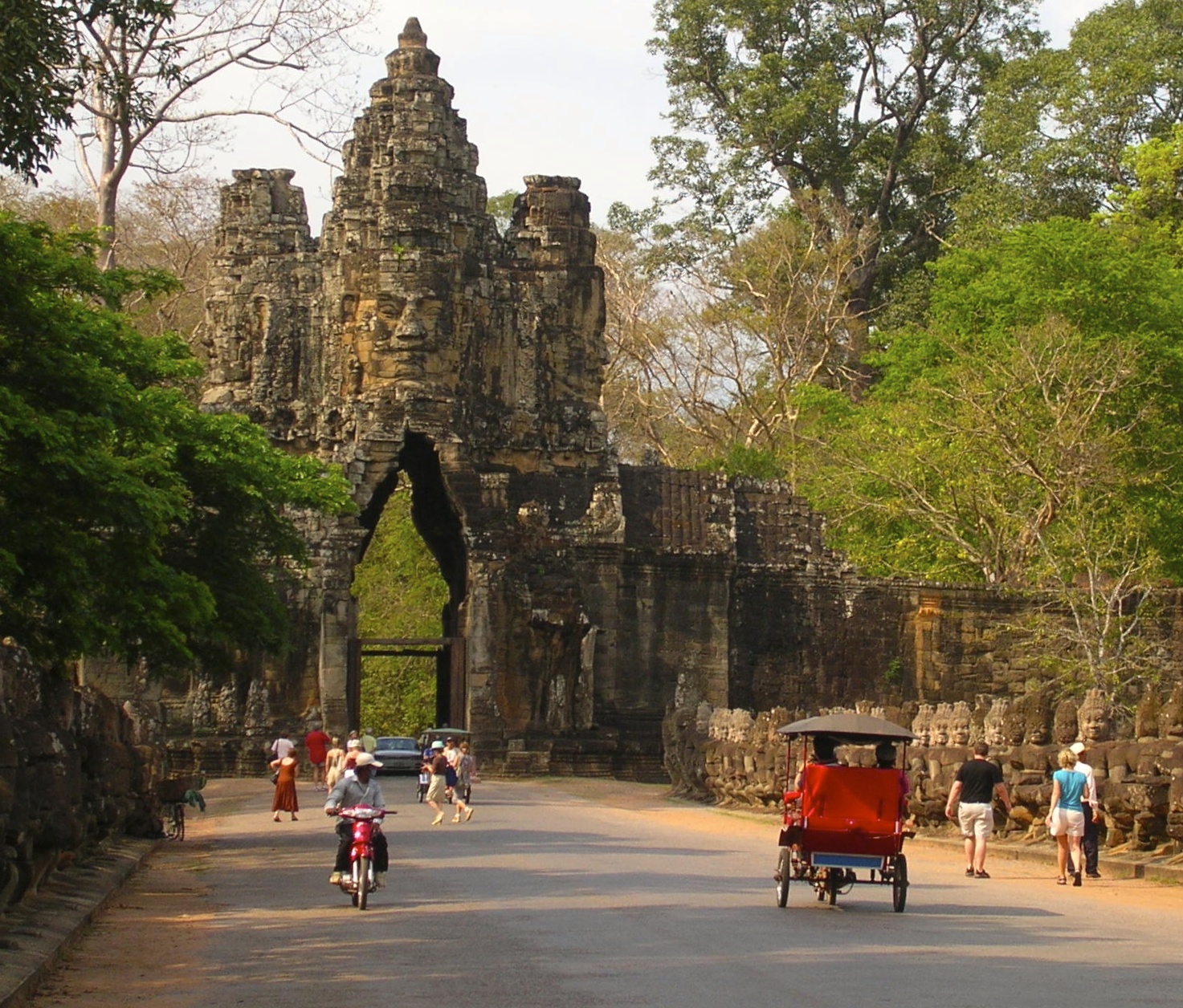 One of the many entries into Angkor Thom. Buddha faces line the streets! Photo by Marla Norman.