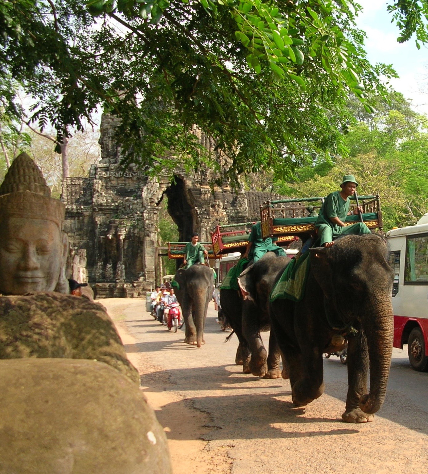 Smiling Buddahs and an elephant rush hour at Angkor Wat. Photos by Marla Norman.