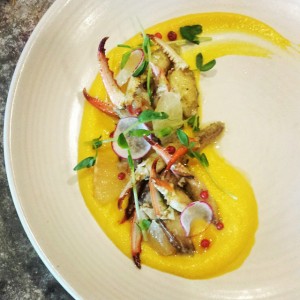 Yellow Beet Ceviche and Crab Fingers with grapefruit, pink pepper, and tarragon. Photo courtesy of John Besh Restaurants.