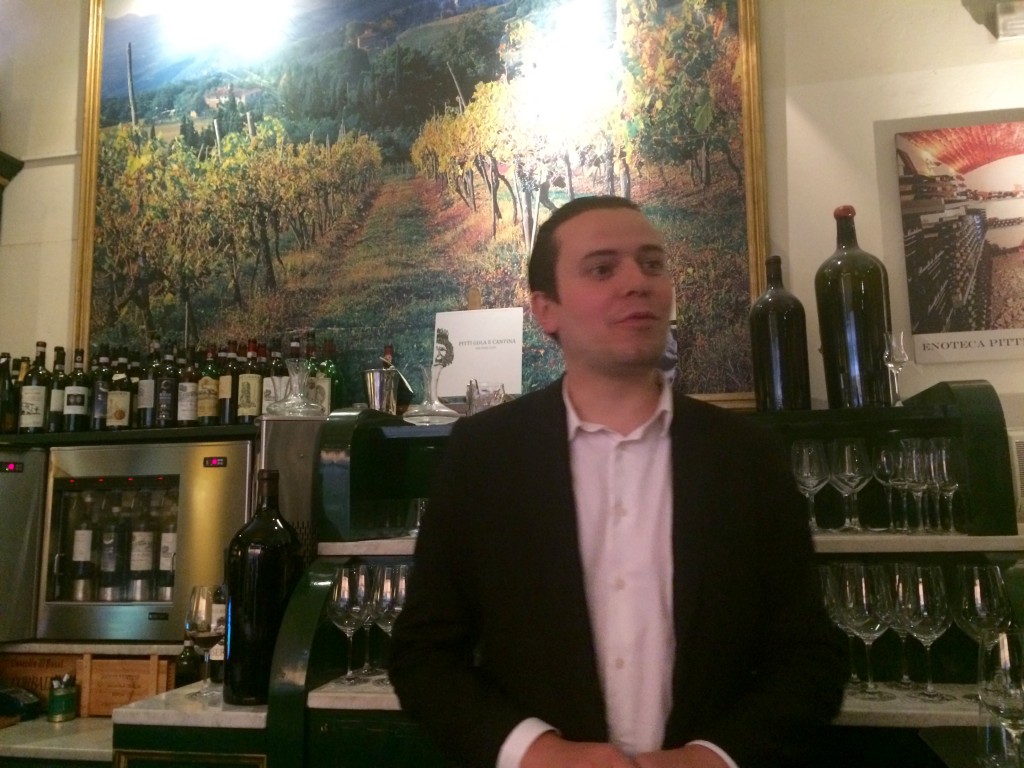 Knowledgeable staff at Enoteca Pitti Gola e Cantina help visitors make informed wine selections. Photo by Marla Norman.