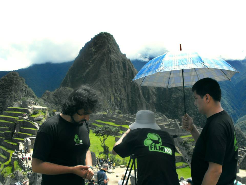 Filmmaker Kenneth O'Brien, founder of The Cusco Project, working on location at Machu Picchu.