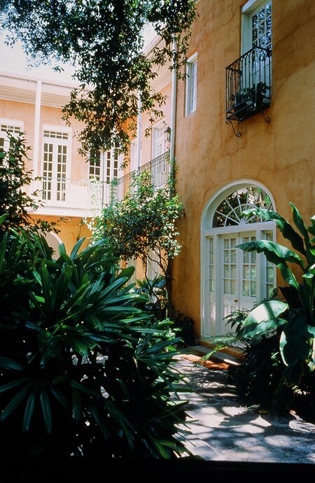 Lush courtyards are available for guests to enjoy with afternoon cocktails or breakfast. Photo courtesy of the Soniat House.