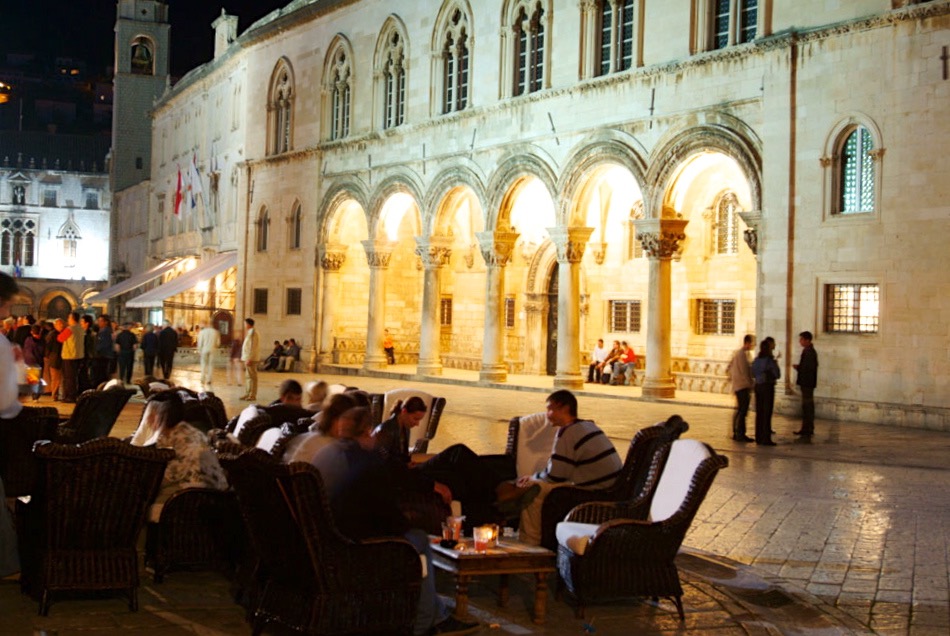 Evening street scene and the elegant Rector's Palace. Photo coutesy of the Regent Esplanade Hotel.