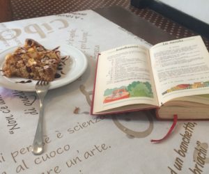 Apple cake with carmel sauce and a well-seasoned Italian cookbook.