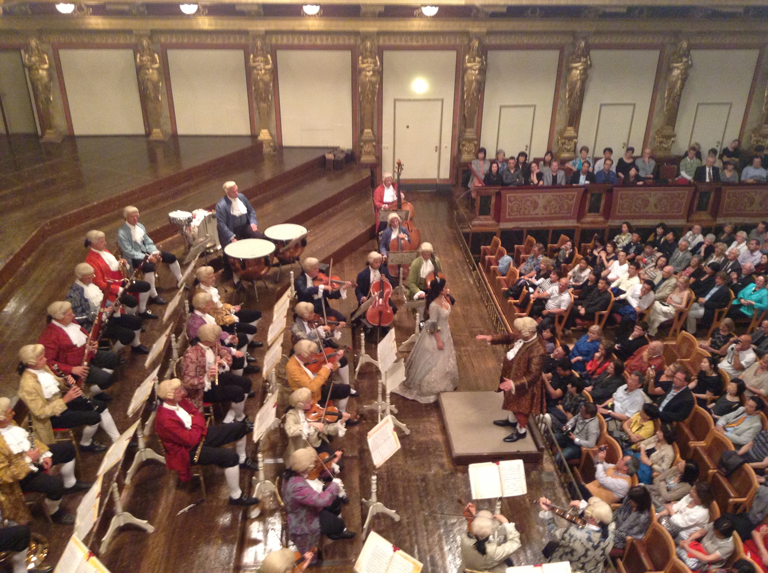 Musicians in costume perform Mozart at the Musikverein Golden Hall.